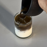 Hojicha poured into glass cup with milk