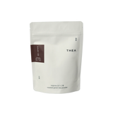 White pouch of THEA hojicha roasted green tea powder on a white background 50g