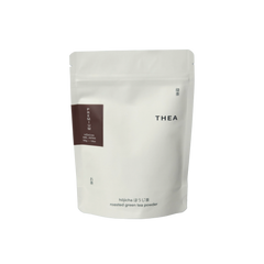 White pouch of THEA hojicha roasted green tea powder on a white background 50g